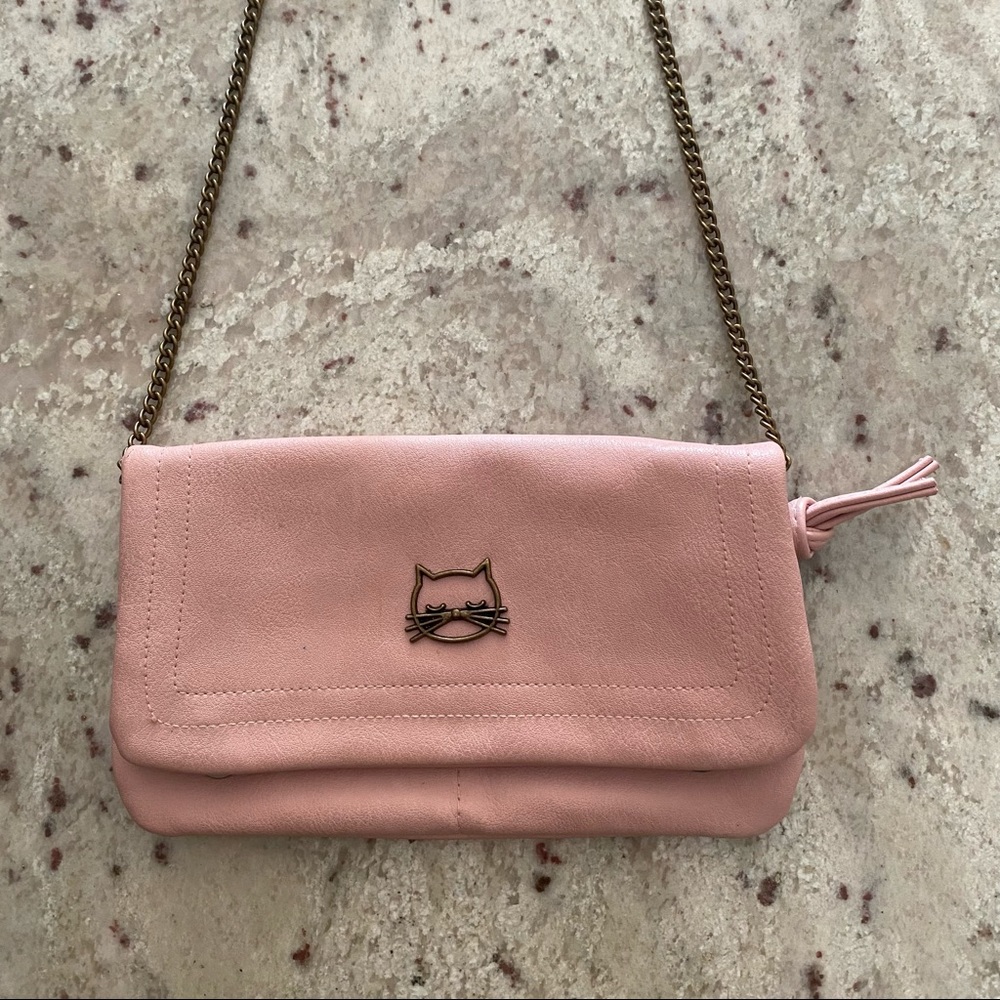 Soft pink clutch to crossbody with kitty cat logo